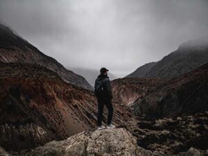 A man standing on the edge of a cliff.