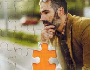 a contemplative man with a missing puzzle piece